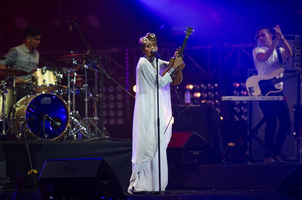 Blockchain could turn the tide for the media and entertainment industry and benefit content creators. (Pictured: Yuna performing on stage at the MTV World Stage Live in Malaysia 2014) (Photo by MOHD RASFAN / AFP)